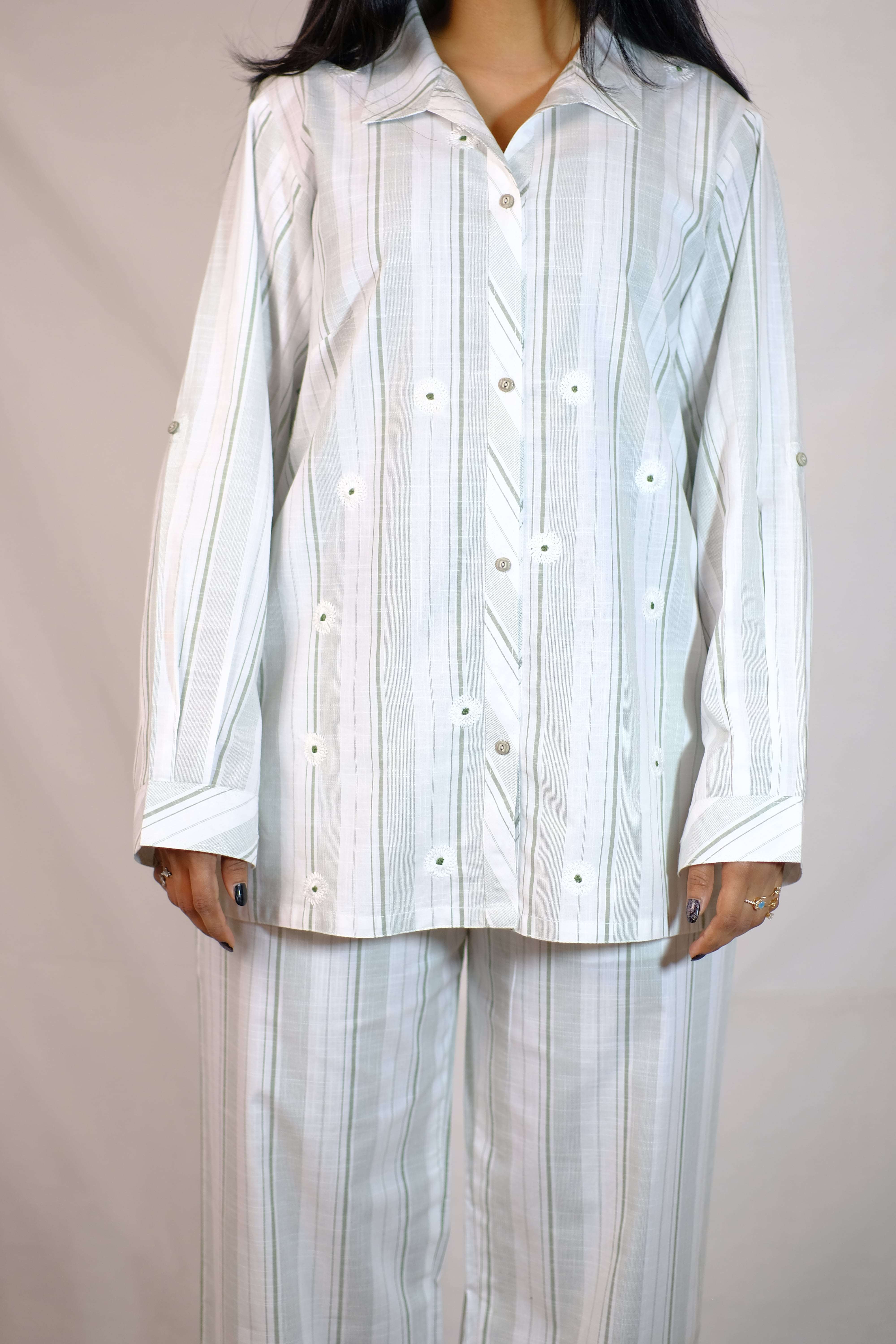 A breezy, striped cotton suit with delicate floral embroidery for effortless elegance.